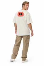 SLOPCANNON Snout Oversized Tee — Faded Bone — worn by a model, back view