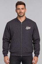Man wearing the Slop Script Bomber Jacket in Midnight Copper Paisley