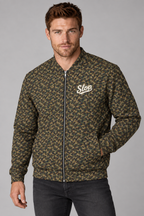 Man wearing the Slop Script Bomber Jacket in Woodland Camo, three-quarter