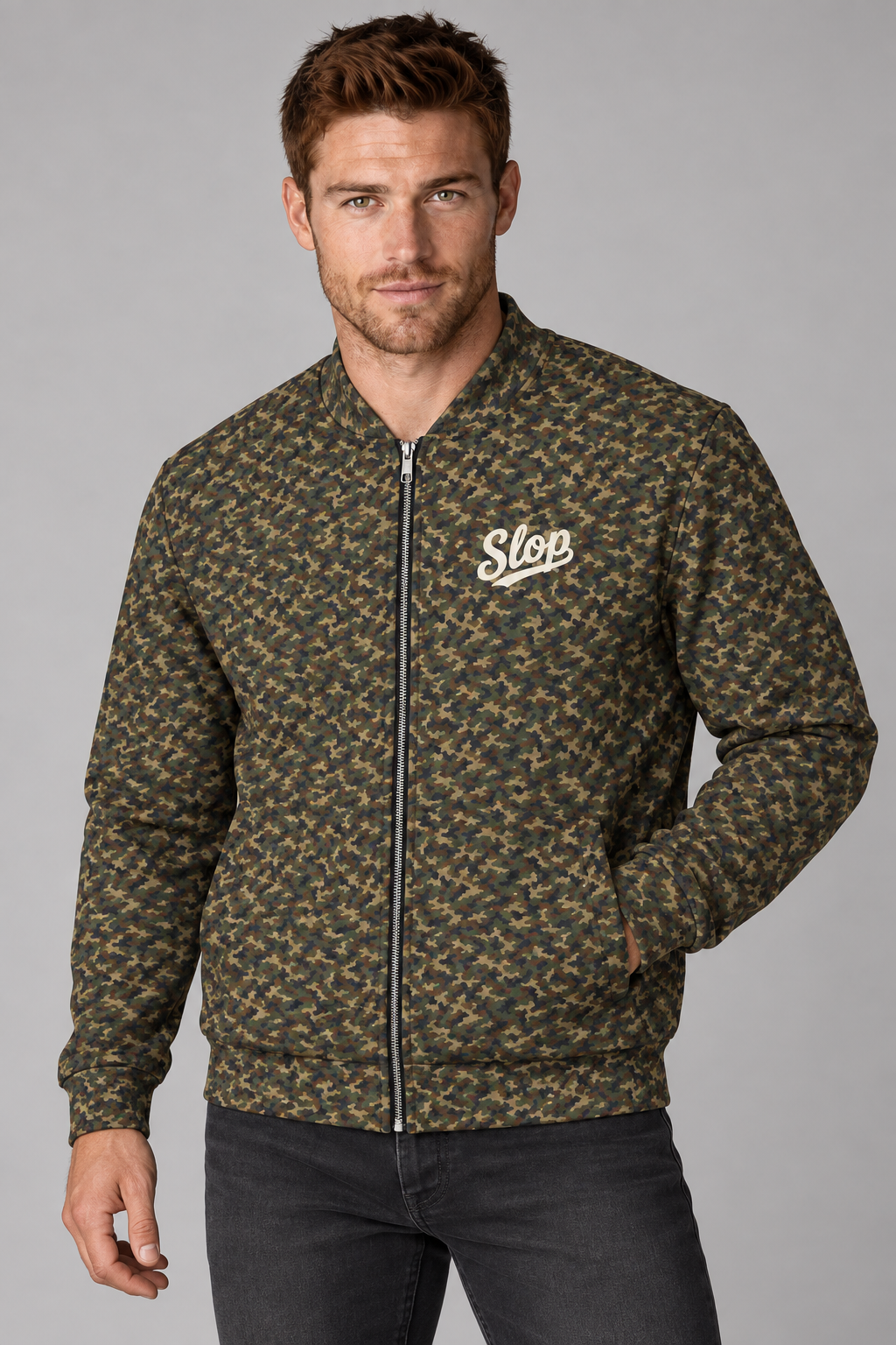Man wearing the Slop Script Bomber Jacket in Woodland Camo, three-quarter