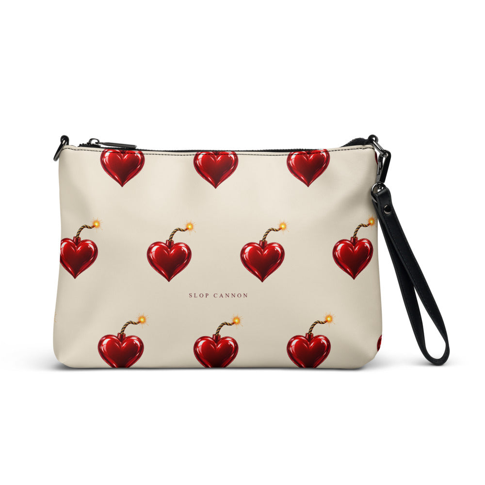 Slop Cannon Heart Fuse Crossbody Bag — Cream / black trim — front view; bag only; printed faux leather with black trim; supplier digital mockup.