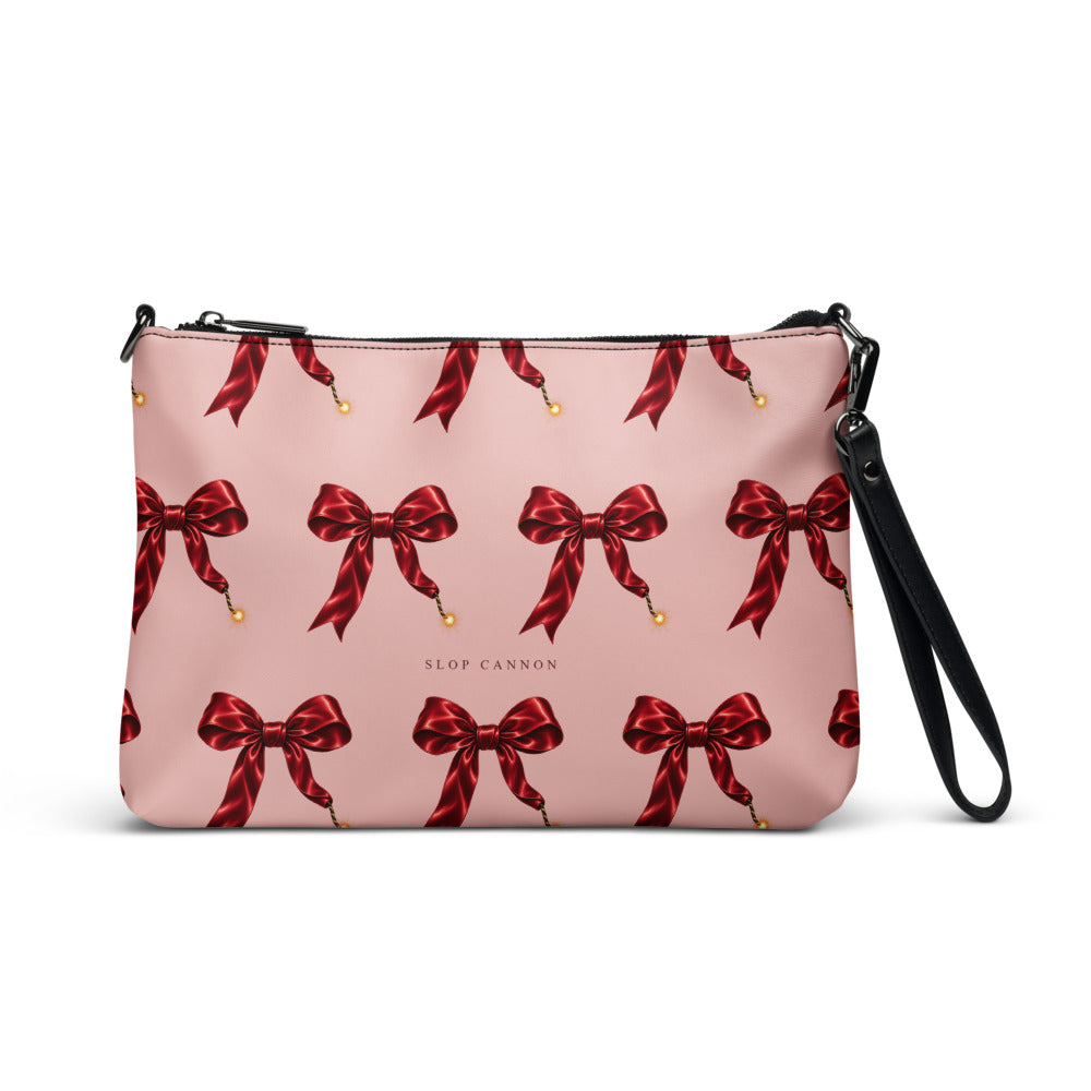 Slop Cannon Short Fuse Crossbody Bag — Blush / black trim — front view; bag only; printed faux leather with black trim; supplier digital mockup.