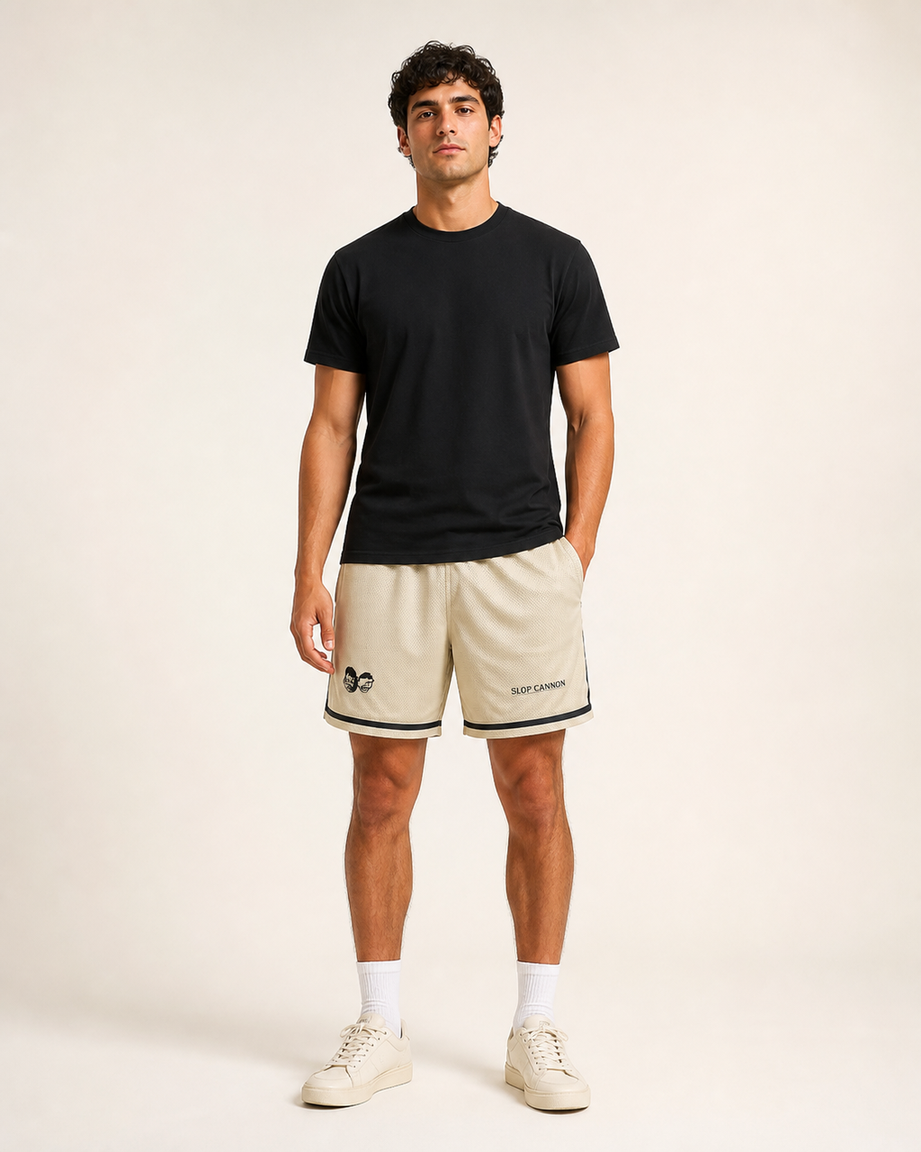 Cannon Boys mesh shorts — Bone (printed) — wearer-right leg heads print-detail crop; Printful all-over-print recycled unisex mesh shorts White base with Bone (printed) pattern; supplier digital mockup; no person shown.