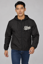 Digital mockup: 098 black EA M01 walking v1; actual EXP54LWZ windbreaker, cream Slop on wearer-left chest only.