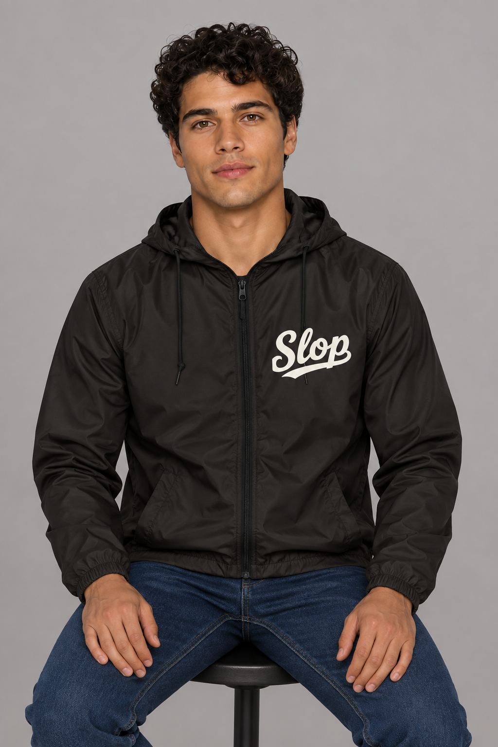 Digital mockup: 098 black HA M02 seated v1; actual EXP54LWZ windbreaker, cream Slop on wearer-left chest only.