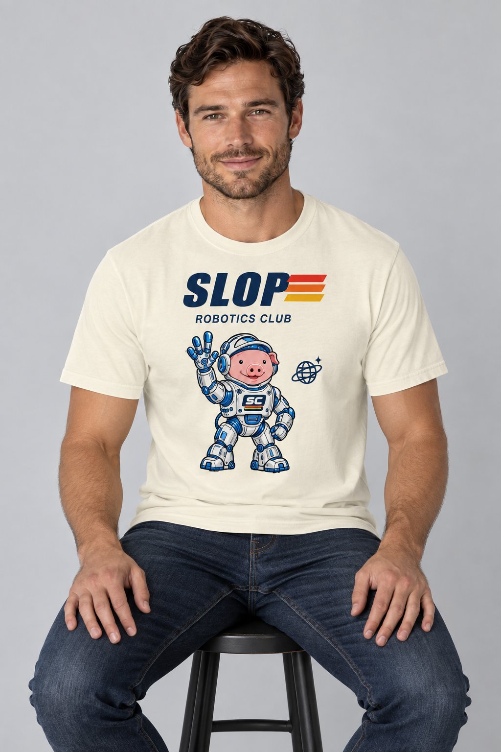 Man wearing the Robotics Club Tee in Ivory, seated