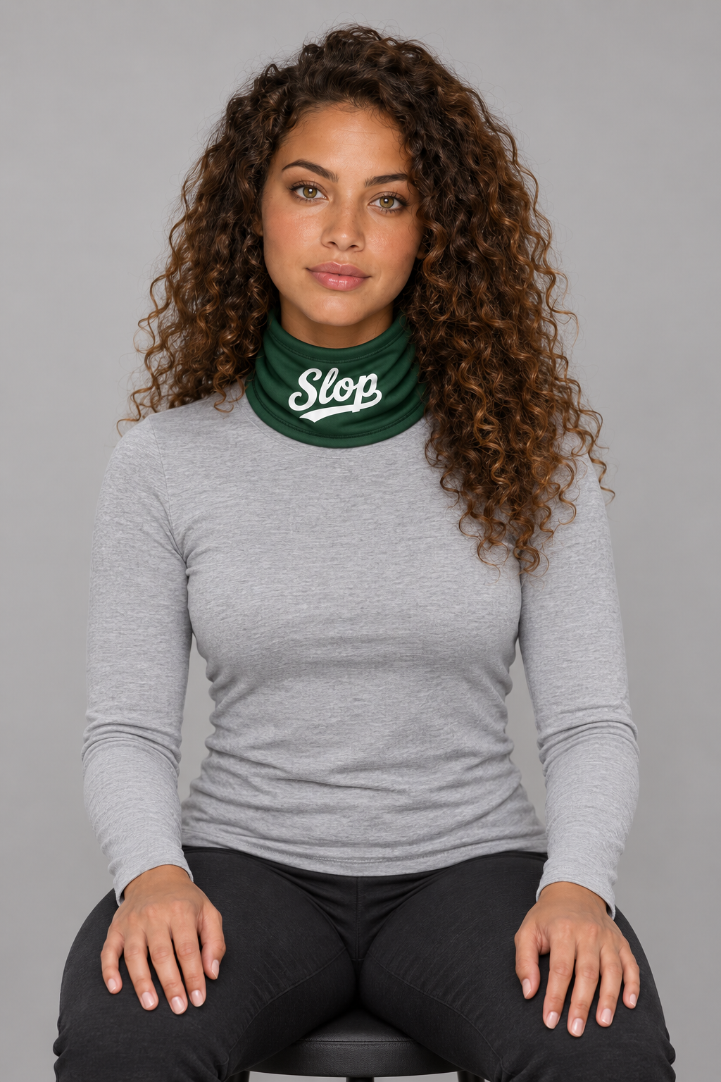 Slop Script Neck Gaiter in Forest Green, worn by a model