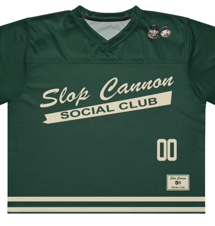 Slop Cannon Social Club — Forest / Cream — front artwork detail cropped from supplier digital mockup; Printful boxy V-neck football jersey White base, printed Forest / Cream; Black stitching; supplier digital mockup.