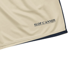 Cannon Boys mesh shorts — Bone (printed) — wearer-left leg underlined SLOP CANNON detail cropped from supplier digital mockup; Printful all-over-print recycled unisex mesh shorts White base with printed Bone (printed); supplier digital mockup.