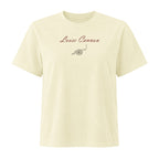 Loose Cannon women's tee — Buttermilk — full front with small burgundy script and cannon print; Women's Heavyweight Garment Dye Tee | Bella + Canvas 6110GD Buttermilk; supplier digital mockup.
