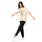 Muse Hotline ivory tee worn by a model in motion
