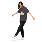 Muse Small Face Big Mood graphite tee worn by a model in motion