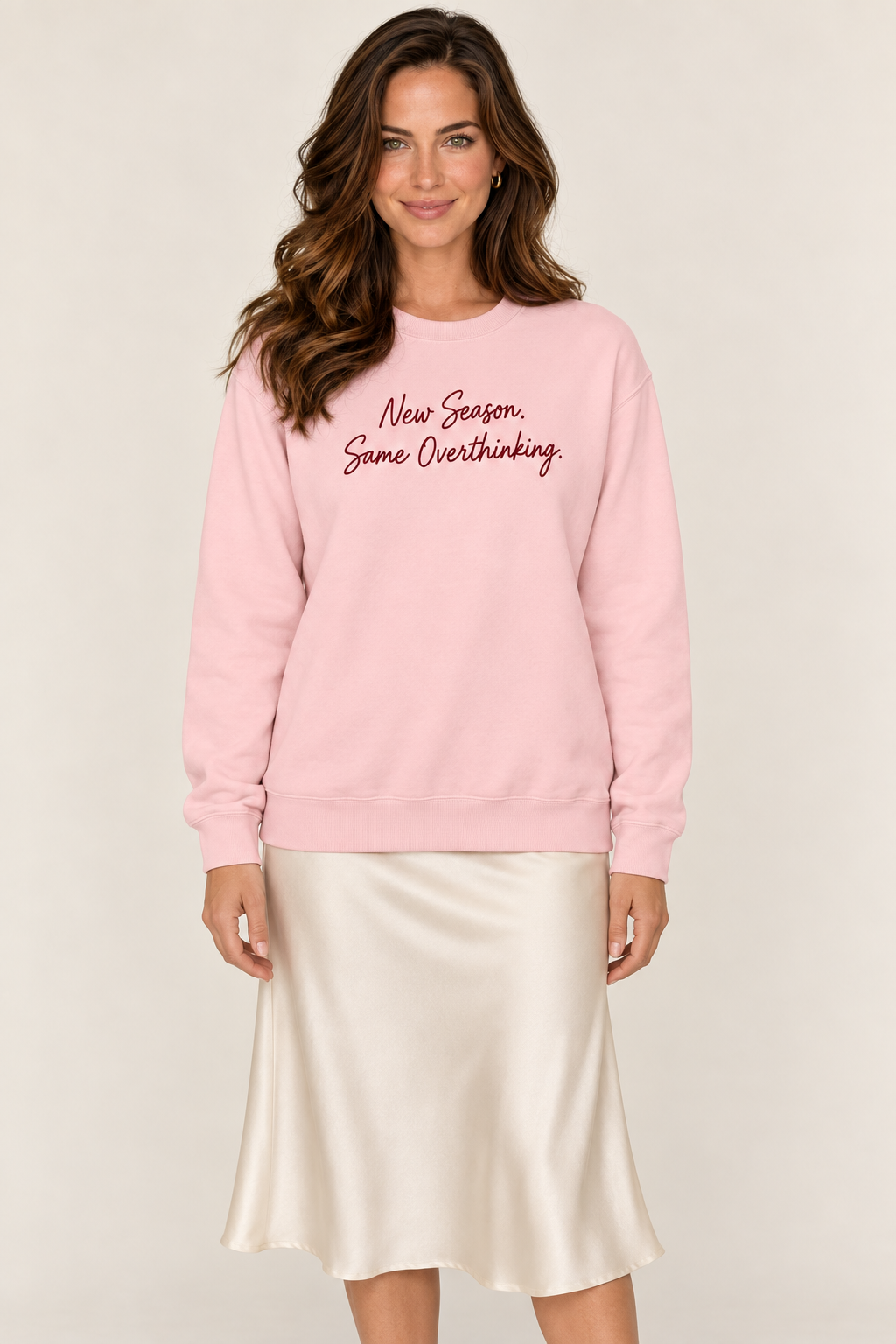 Brooke Ellis wearing the Light Pink script sweatshirt, front standing view