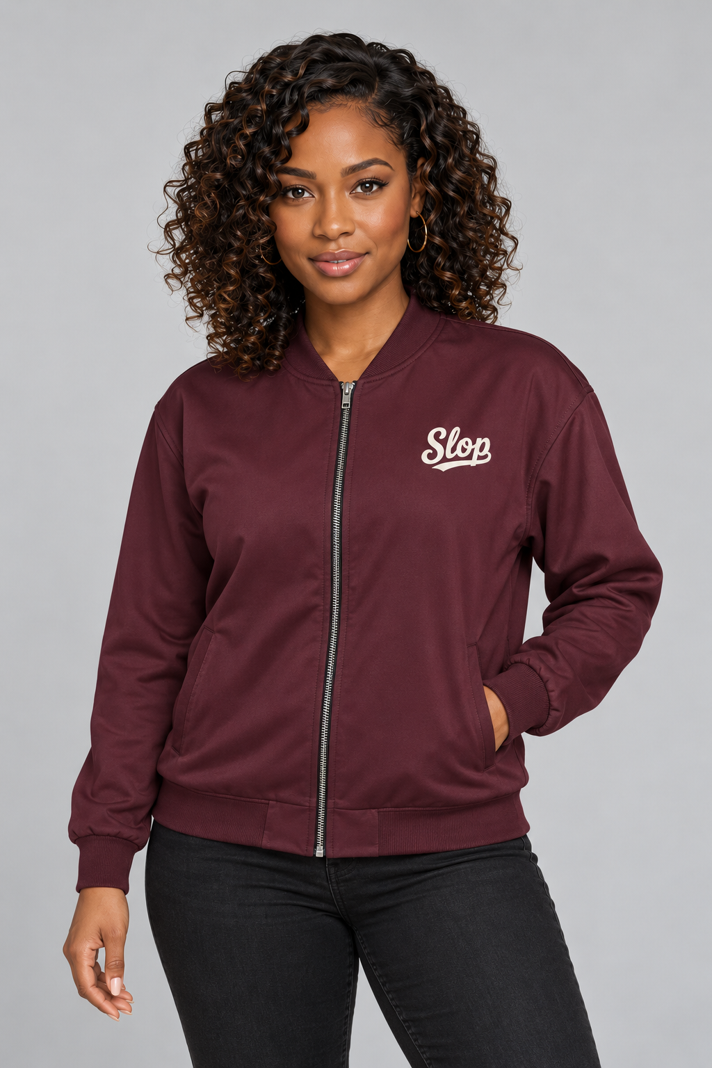 Woman wearing the Slop Script Bomber Jacket in Oxblood