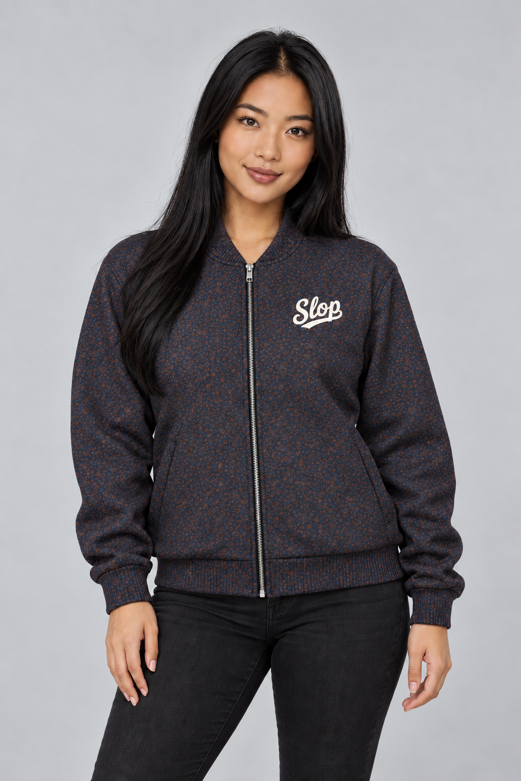 Woman wearing the Slop Script Bomber Jacket in Midnight Copper Paisley