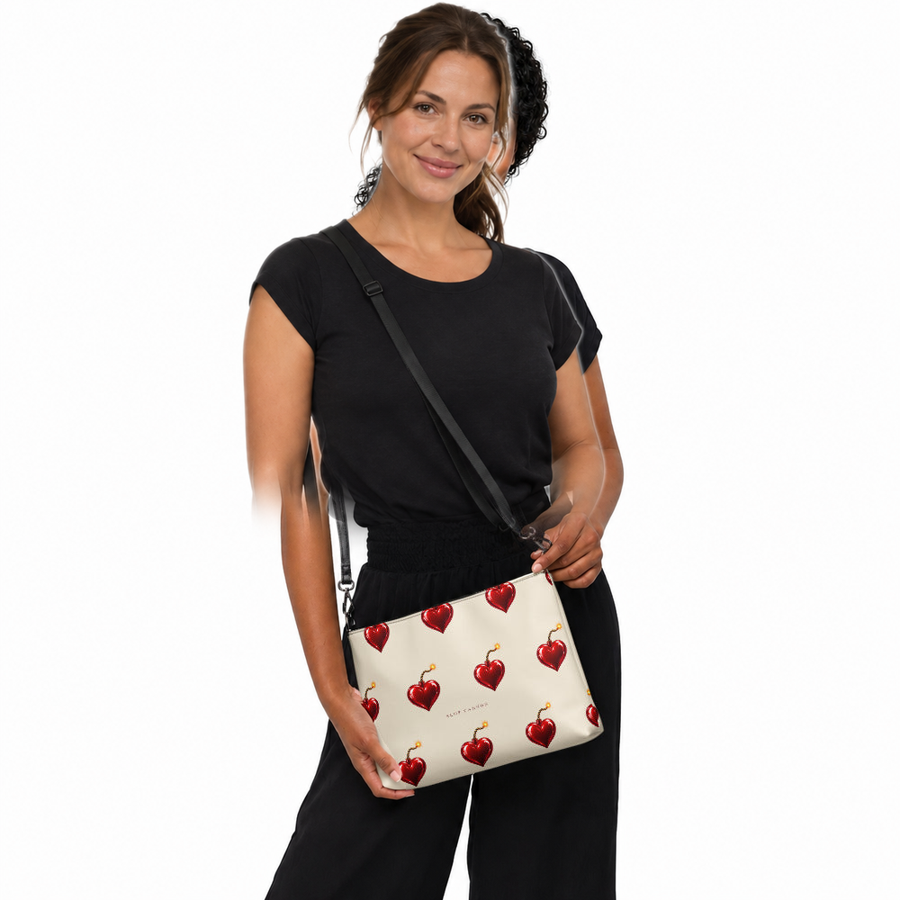 Slop Cannon Heart Fuse Crossbody Bag — Cream / black trim — CW-F12 adult woman model view; exact configured bag, straps and artwork; digital model composite; accessory only, outfit excluded.