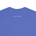 Smoke Signal tee — Flo Blue — outside-neckline wordmark detail cropped from actual supplier digital mockup; Comfort Colors 1717 garment-dyed heavyweight tee; actual configured Flo Blue; tee only. Digital crop shows placement, not a manufactured sample photograph.
