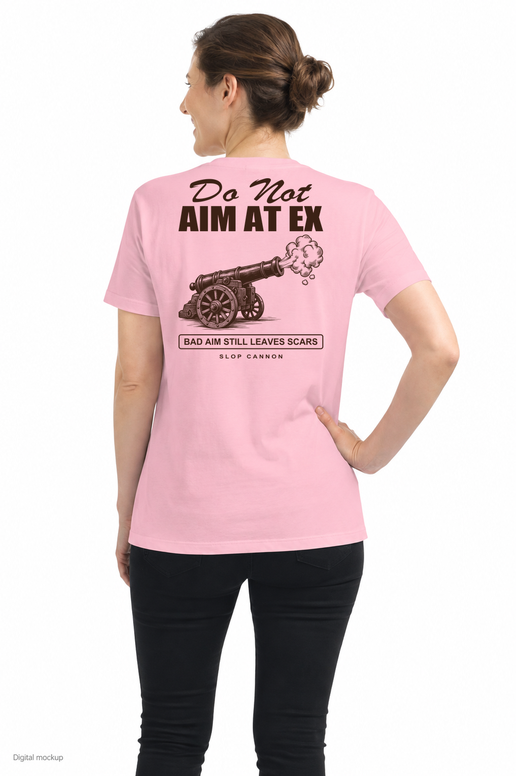 Do Not Aim At Ex — Pink — back model view with exact configured DO NOT AIM AT EX warning and cannon artwork; digital composite checked against supplier preview. Tee only; other clothing is styling and is not included.