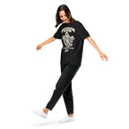 Hallucination Season Tee in Black, worn by a model